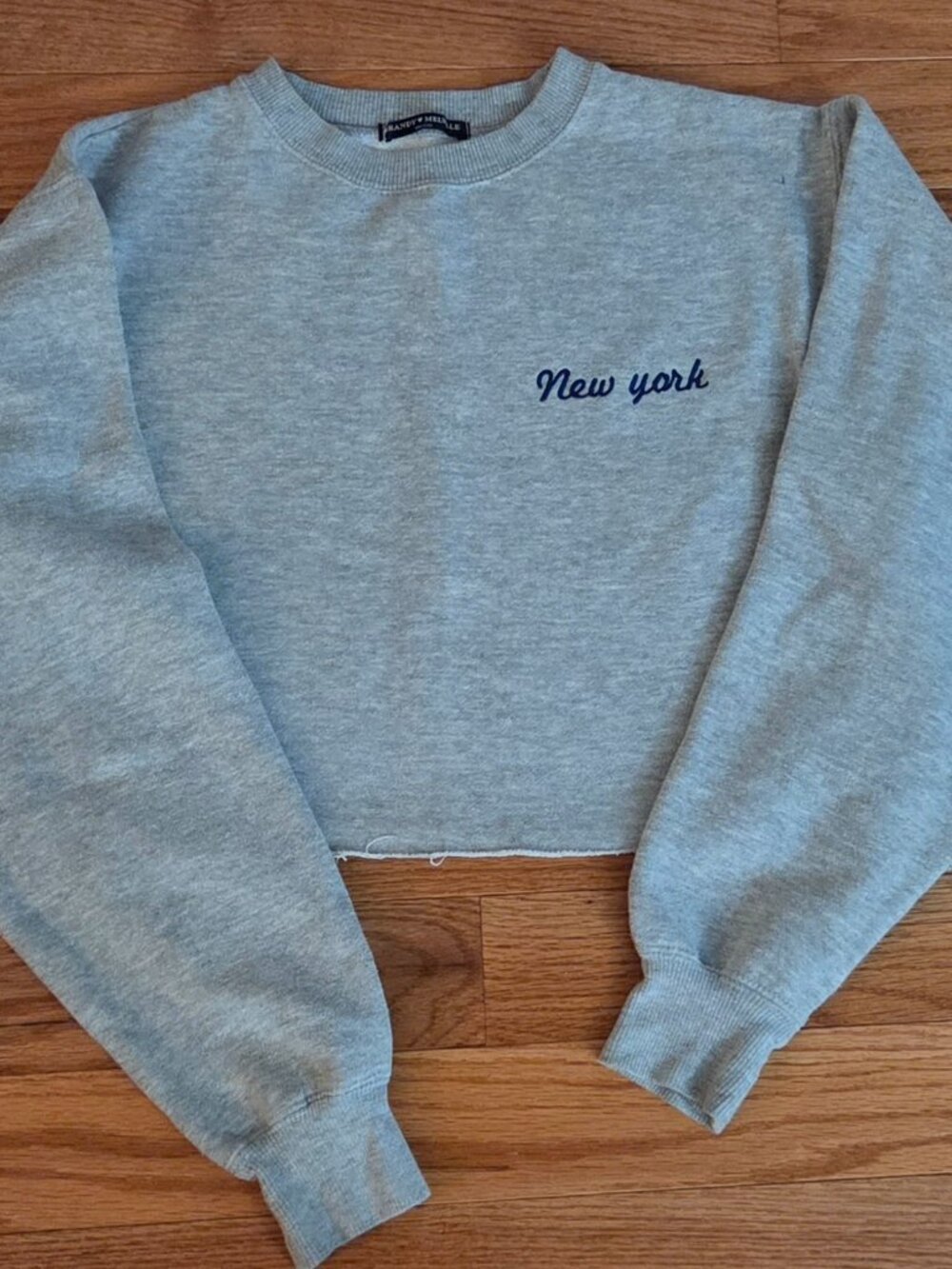 Brandy Melville "New York" Cropped Sweatshirt with raw hem.  Color:Grey.